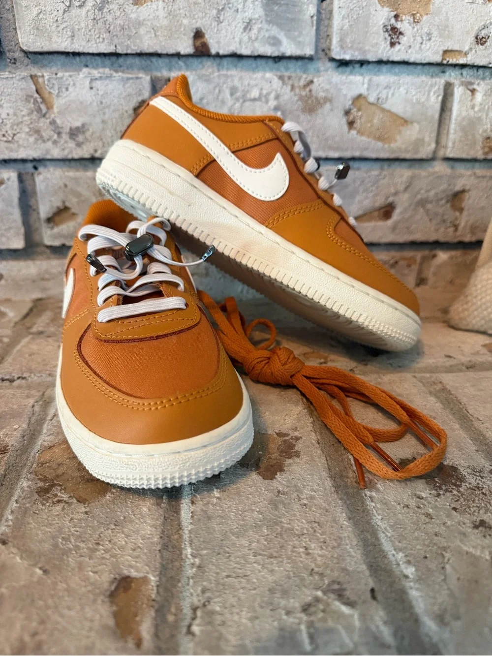 Nike Kids Force 1 Orange Low-Top Sneakers with White Swoosh